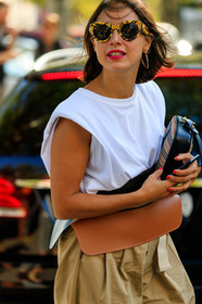 charlotte chesnais earrings, versace sunglasses, printed sunglasses, yellow sunglasses, white t-shirt, sleeveless t-shirt, camel leather belt, carrot pants, beige pants, close up detail, fashion week, frenchystyle, FW, jonathan paciullo, street style, vertical, atmosphere details, detail, MFW, MILAN, SPRING SUMMER 2020, SS 20