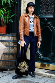 devon ross, brown leather jacket, zipped jacket, navy blue pants, striped pants, grey pullover, numbers printed pullover, printed pullover, black bag, velvet bag, shopping bag, tote bag, embroidered bag, sequins bag, golden bag, letter embroidered bag, fashion week, frenchystyle, FW, jonathan paciullo, street style, PFW, PARIS, SPRING SUMMER 2021, SS 21, vertical, full length, model