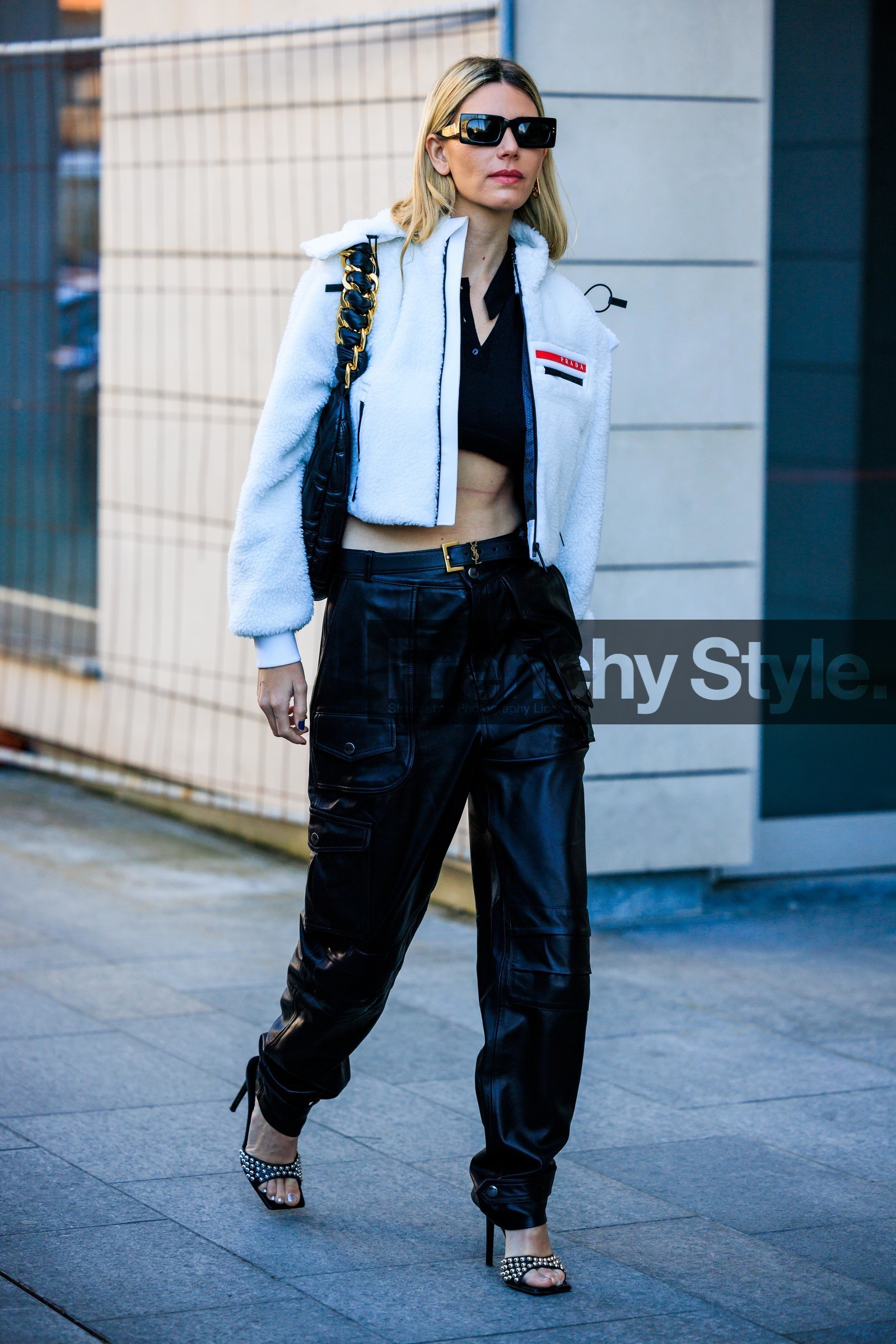 cargo pants, leather trousers, prada jacket, short jacket, puffed jacket, black glasses, squared glasses, studs sandals, black handbag, leather handbag, chain handbag, black sandals, black belt white jacket, prada, black trousers, fashion week, frenchystyle, FW, jonathan paciullo, street style, vertical, full length