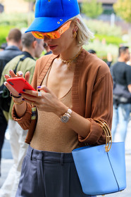 viktoria rader, blue cap, sportmax cap, beige cardigan, beige top, low necked top, neon orange sunglasses, gucci sunglasses, golden watch, grey pants, tailored pants, light blue leather bag, hand bag, fashion week, frenchystyle, FW, jonathan paciullo, street style, vertical, atmosphere details, detail, MFW, MILAN, SPRING SUMMER 2020, SS 20