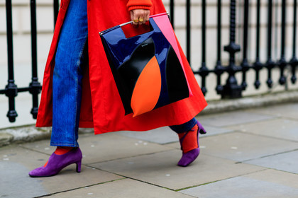 black bag, blue denim, denim pants, graphic bag, high heels, jeans, leather bag, leather shoes, multicolor bag, printed bag, purple shoes, red coat, trousers, street style, jonathan paciullo, FW, frenchystyle, fashion week, LFW, LONDON, AUTUMN WINTER 2018-2019, AW 18-19, FALL WINTER 2018-2019, FW 18-19, horizontal, atmosphere details, detail, carola bernard