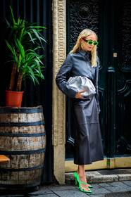 leonie hanne, black leather skirt, grey leather shirt, silver clutch, bottega veneta bag, neon green sunglasses, scale sunglasses, futurist shape sunglasses, fenty sunglasses, neon green earrings, round shape earrings, dangling earrings, long skirt, neon green sandals, fashion week, frenchystyle, FW, jonathan paciullo, street style, PFW, PARIS, SPRING SUMMER 2021, SS 21, vertical, full length