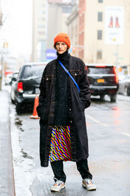 black denim, black pants, black sweater, denim coat, graphic skirt, leather shoes, model, multicolor skirt, orange beanie, printed skirt, trousers, turtleneck sweater, vans, white sneakers, street style, jonathan paciullo, frenchystyle, NYFW, NEW YORK, AUTUMN WINTER 2019-2020, AW 19-20, FALL WINTER 2019-2020, FW 19-20, fashion week, FW, vertical, atmosphere details, detail