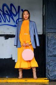 beige shoes, belt, blazer, checked, checked jacket, earrings, graphic bag, graphic jacket, grey jacket, high boots, high heels, leather bag, leather shoes, orange dress, over the shoulder, pink bag, plaid, pleated dress, printed jacket, tartan, street style, jonathan paciullo, FW, frenchystyle, fashion week, NYFW, NEW YORK, AUTUMN WINTER 2018-2019, AW 18-19, FALL WINTER 2018-2019, FW 18-19, vertical, full length, aimee song