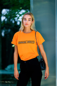 black bag, black denim, denim pants, jeans, leather bag, Maartje Verhoef, model, orange top, printed t shirt, trousers, street style, jonathan paciullo, FW, frenchystyle, fashion week, MFW, MILAN, SPRING SUMMER 2019, SS 19, vertical, atmosphere details, detail