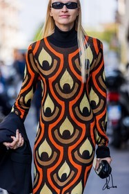 black jacket; black sunglasses; color; colorful; dress; orange dress; print; printed dress; sunglasses; tube dress; turtleneck; turtleneck dress; 70s