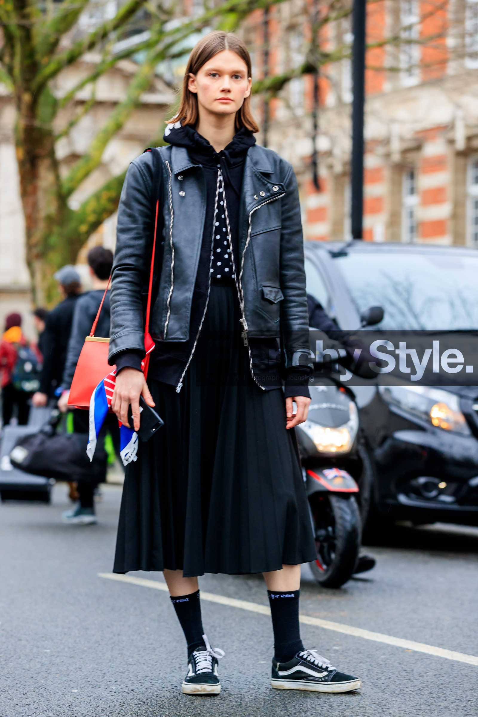 black jacket, black shoes, black skirt, black sneakers, black socks, black sweater, céline, hoodie, leather bag, leather jacket, leather shoes, pleated skirt, polka dot, printed scarf, red bag, vans, street style, jonathan paciullo, FW, frenchystyle, fashion week, LFW, LONDON, AUTUMN WINTER 2018-2019, AW 18-19, FALL WINTER 2018-2019, FW 18-19, vertical, full length, model