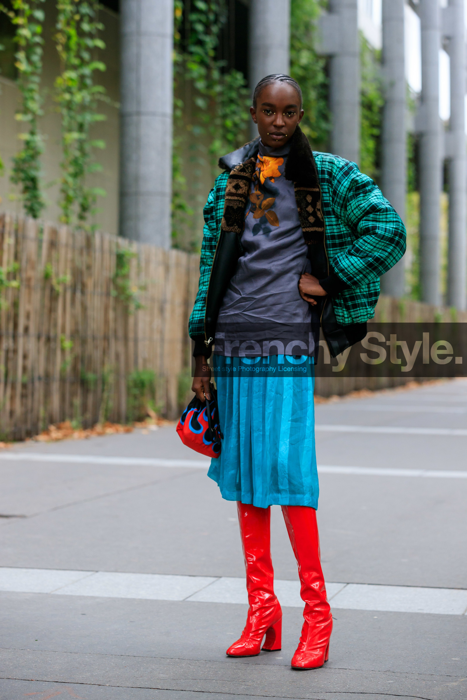 model, red polish boots, high boots, high heels boots, light blue skirt, mid long skirt, pleated skirt, prada bag, hand bag, fire printed bag, black bag, bucket bag, red bag, printed bag, floral printed blouse, dark grey blouse, silk blouse, high collar blouse, dark grey t-shirt, floral printed t-shirt, green coat, green bombers, fur collar coat, checked coat, fur coat, make up, make up details, studs make up, strassed make up, fashion week, frenchystyle, FW, jonathan paciullo, street style, SPRING SUMMER 2020, SS 20, PFW, PARIS, vertical, full length