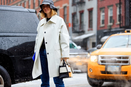 black and white bag, black bag, black hat, blue denim, bucket hat, denim pants, jeans, leather bag, lisa aiken, trousers, white coat, street style, jonathan paciullo, frenchystyle, NYFW, NEW YORK, AUTUMN WINTER 2019-2020, AW 19-20, FALL WINTER 2019-2020, FW 19-20, FW, fashion week, atmosphere details, horizontal, detail