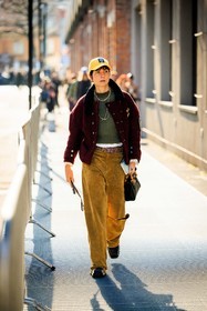yellow cap, green jumper, baseball jacket, burgundy jacket, mutliple chains, yellow msutands pants, shiny belt, black handbag, bamboo guccis hanbag, leather handbag, bag, gucci, black shoes, leather boots, eva geraldine fontanelli, street style, jonathan paciullo, FW, frenchystyle, fashion week, MFW, MILAN, FALL WINTER 2022_2023, AUTUMN WINTER 2022-2023, FW 22-23, vertical, full length