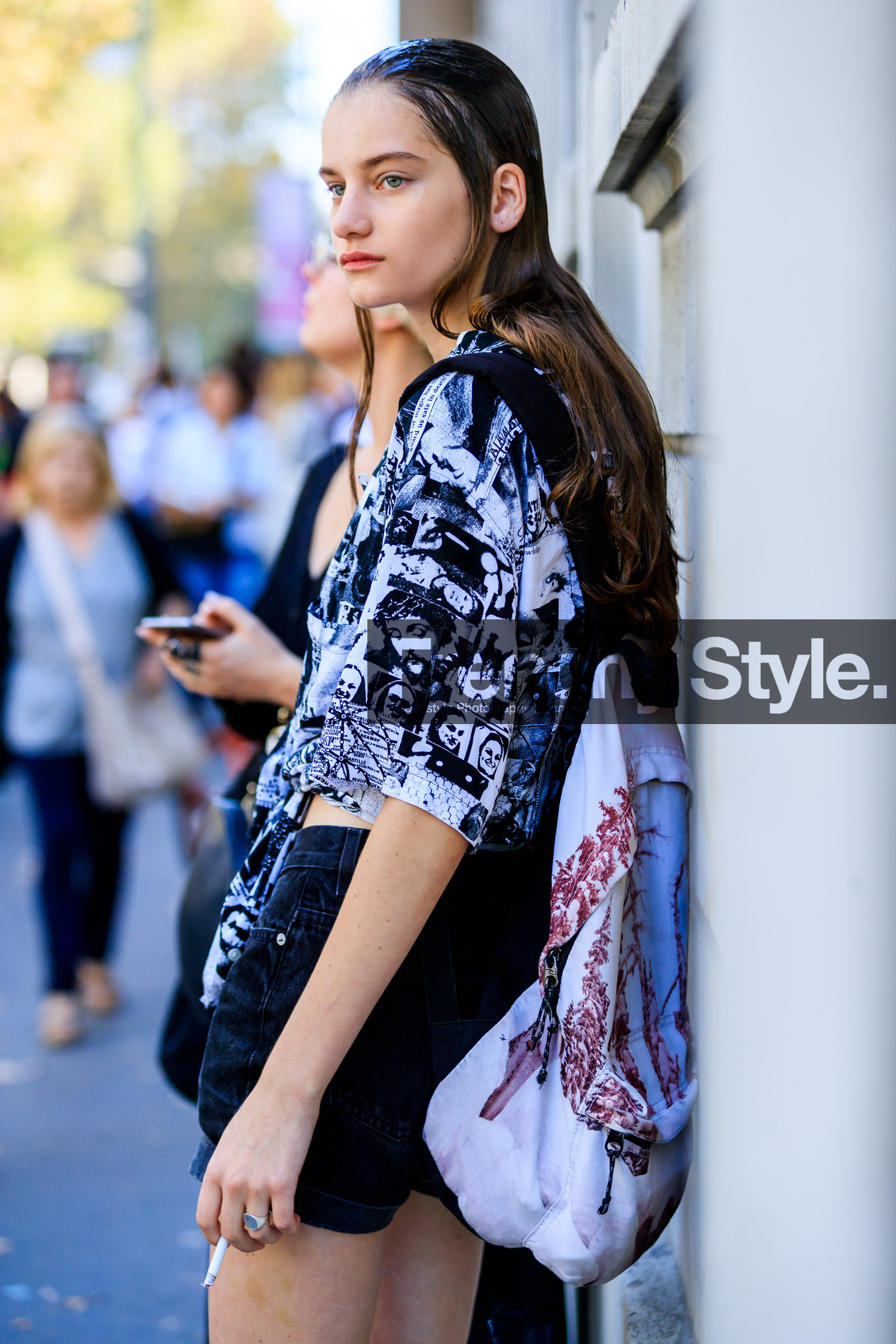 backpack, black denim, black shirt, denim shorts, graphic bag, graphic shirt, headphones, leather bag, model, printed bag, printed shirt, wet hair, street style, jonathan paciullo, FW, frenchystyle, fashion week, MFW, MILAN, SPRING SUMMER 2019, SS 19, vertical, atmosphere details, detail