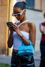 asymetrical top, bag, balenciaga bag, blue bag, bun, croc bag, detail, hourglass bag, Jamilla Stand, leather bag, smartphone, sunglasses, watch, white sunglasses, white top, fashion week, frenchystyle, FW, jonathan paciullo, street style, MFW, MILAN, SPRING SUMMER 2022, SS 22, vertical, atmosphere details