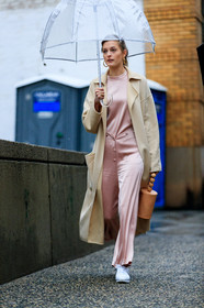 beige coat, brown bag, graphic bag, leather bag, leather shoes, pink jumpsuit, pink pants, pink top, trousers, umbrella, white sneakers, street style, jonathan paciullo, FW, frenchystyle, fashion week, NYFW, NEW YORK, AUTUMN WINTER 2018-2019, AW 18-19, FALL WINTER 2018-2019, FW 18-19, vertical, full length