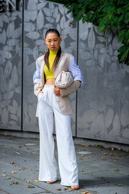 beige bag, beige jacket, blue shirt, bottega veneta, earrings, graphic shirt, jaime xie, leather bag, ponytail, printed shirt, sleeveless, striped shirt, trousers, white bag, white pants, yellow sweater, street style, jonathan paciullo, FW, frenchystyle, fashion week, NEW YORK, NYFW, SPRING SUMMER 2020, SS 20, vertical, full length