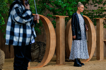 dior bag, dior earrings, black leather jacket, burgundy bag, monogrammed bag, white dress, polka dots dress, hoop earrings, golden earrings, black leather boots, big sole boots, laced boots, prada boots, fashion week, frenchystyle, FW, jonathan paciullo, street style, SPRING SUMMER 2020, SS 20, PFW, PARIS, horizontal, atmosphere details, full length