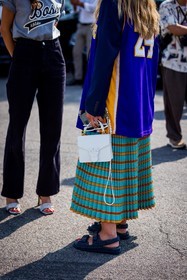 blue skirt, blue t-shirt, chanel sandals, color, denim sandals, football t-shirt, leather bag, pinko bag, pleated skirt, print, striped skirt, stripes, turquoise skirt, white bag, fashion week, frenchystyle, FW, jonathan paciullo, street style, MFW, MILAN, SPRING SUMMER 2022, SS 22, vertical, atmosphere details, detail