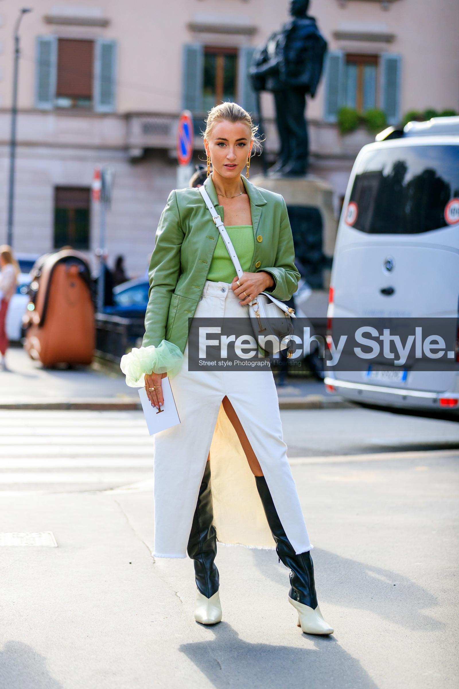 big chain earrings, golden earrings, dangling earrings, light green jacket, leather jacket, light green top, white denim skirt, long skirt, split skirt, white leather bag, crossbody bag, tods bag, ruffle blouse, high boots, black leather boots, white leather boots, cowboy boots, fashion week, frenchystyle, FW, jonathan paciullo, street style, vertical, full length, MFW, MILAN, SPRING SUMMER 2020, SS 20