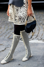 white leather dress, white leather boots, black leather belt, black leather bag, black tights, corset belt, mini skirt, openwork skirt, short sleeves dress, high boots, kitten heels boots, fishnet shoes, dior bag, dior boots, dior dress, dior belt, close up detail, bag detail, legs detail, dior saddle bag, fashion week, frenchystyle, FW, jonathan paciullo, street style, PFW, PARIS, AUTUMN WINTER 2020-2021, FALL WINTER 2020-2021, FW 20-21, vertical, atmosphere details, detail