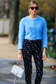 camille charriere, light blue cardigan, mohair cardigan, button cardigan, strassed cardigan, strassed pants, black pants, tight pants, rayban sunglasses, white leather bag, quilted bag, hand bag, strassed earrings, round shape earrings, logo earrings, chanel bag, chanel cardigan, chanel pants, chanel earrings, fashion week, frenchystyle, FW, jonathan paciullo, street style, PFW, PARIS, vertical, atmosphere details, detail