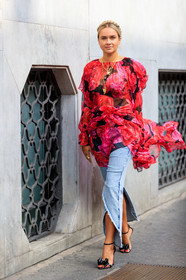nina suess, plaited hair, multi necklace, chain necklace, charms necklace, floral printed blouse, red blouse, pink blouse, ruffle blouse, light blue jeans, split pants, black sandals, knot details shoes, drape blouse, fashion week, frenchystyle, FW, jonathan paciullo, street style, vertical, full length, MFW, MILAN, SPRING SUMMER 2020, SS 20