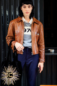 devon ross, brown leather jacket, zipped jacket, navy blue pants, striped pants, grey pullover, numbers printed pullover, printed pullover, black bag, velvet bag, shopping bag, tote bag, embroidered bag, sequins bag, golden bag, letter embroidered bag, fashion week, frenchystyle, FW, jonathan paciullo, street style, PFW, PARIS, SPRING SUMMER 2021, SS 21, vertical, atmosphere details, detail, model