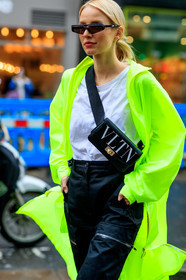 black bag, black pants, fanny pack, graphic bag, green coat, leather bag, leonie hanne, neon, printed bag, rain coat, sunglasses, trousers, valentino, white t shirt, LONDON, LFW, fashion week, frenchystyle, FW, jonathan paciullo, street style, AUTUMN WINTER 2019-2020, AW 19-20, FW 19-20, FALL WINTER 2019-2020, vertical, atmosphere details, detail
