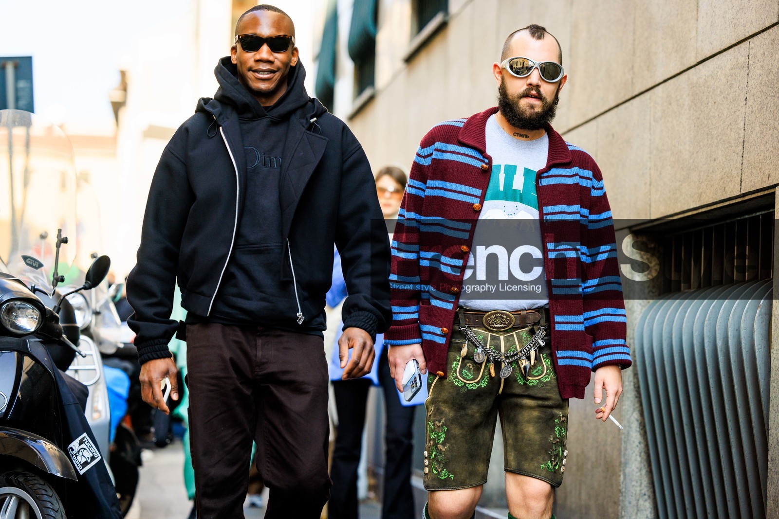 black hoodie, black bomber jaclet, brown pants, stripes cardigan, multicolor cardigan, silver glasses, black glasses, printed tshirt, white tshirt, buckled belt, chained belt, charms belt, washed shorts, embroidered shorts, street style, jonathan paciullo, FW, frenchystyle, fashion week, MFW, MILAN, FALL WINTER 2022_2023, AUTUMN WINTER 2022-2023, FW 22-23, horizontal, atmosphere details