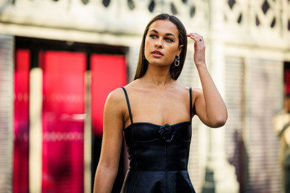 valentino, valetino earrings, logo earrings, mini dress, black dress, leather dress, black stockings, valentino bag, black handbag, details, rose dress, valentino dress, sarah lysander, street style, jonathan paciullo, FW, frenchystyle, fashion week, AUTUMN WINTER 2022-2023, FALL WINTER 2022_2023, FW 22-23, PARIS, PFW, horizontal, atmosphere details, detail
