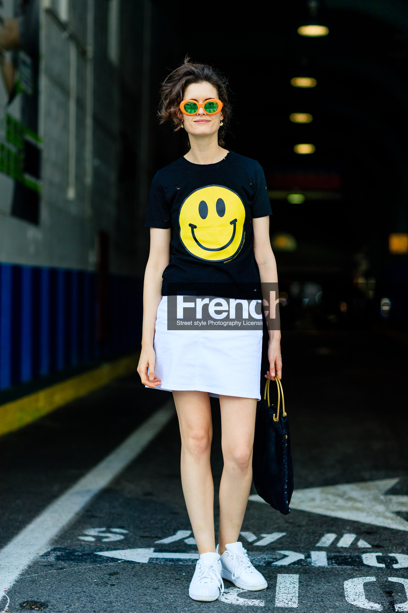 black bag, black t shirt, fashion week, frenchystyle, full length, FW, jonathan paciullo, leather bag, leather sneakers, NEW YORK, NYFW, printed t shirt, smiley, SPRING SUMMER 2017, SS 17, street style, sunglasses, vertical, white skirt, white sneakers, woman