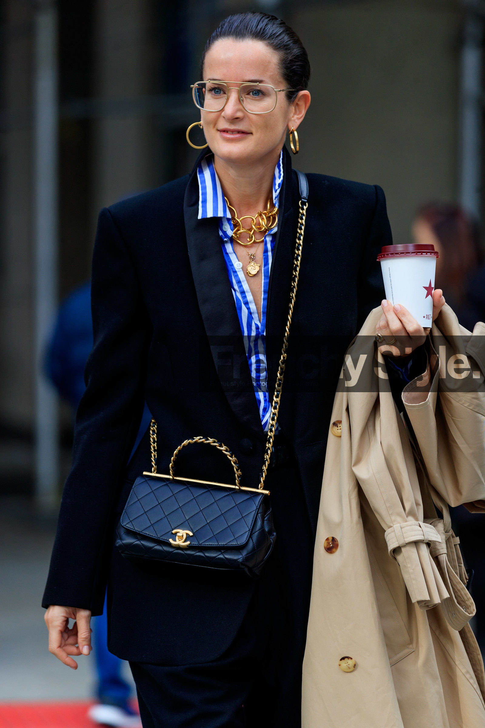 Lucy Chadwick, black jacket, black leather bag, black pants, blue shirt, white shirt, striped shirt, big chain necklace, multi necklace, charms necklace, golden frame glasses, metalic frame sunglasses, aviator glasses, hoop earrings, golden earrings, golden chain strap bag, crossbody bag, chanel bag, quilted bag, beige trench coat, satin jacket, golden necklace, fashion week, frenchystyle, FW, jonathan paciullo, street style, NYFW, NEW YORK, AUTUMN WINTER 2020-2021, FALL WINTER 2020-2021, FW 20-21, vertical, detail, atmosphere details