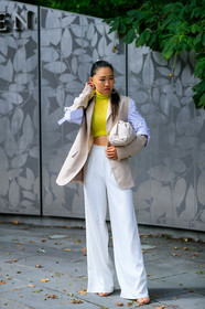 beige bag, beige jacket, blue shirt, bottega veneta, earrings, graphic shirt, jaime xie, leather bag, ponytail, printed shirt, sleeveless, striped shirt, trousers, white bag, white pants, yellow sweater, street style, jonathan paciullo, FW, frenchystyle, fashion week, NEW YORK, NYFW, SPRING SUMMER 2020, SS 20, vertical, full length