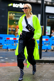 balenciaga, black and white shoes, black bag, black pants, black shoes, fanny pack, graphic bag, green coat, high heels, leather bag, leather shoes, leonie hanne, neon, printed bag, rain coat, sunglasses, trousers, valentino, white t shirt, LONDON, LFW, fashion week, frenchystyle, FW, jonathan paciullo, street style, AUTUMN WINTER 2019-2020, AW 19-20, FW 19-20, FALL WINTER 2019-2020, vertical, full length