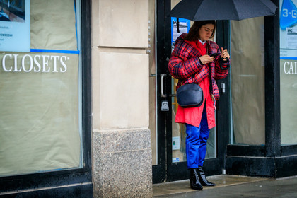 black bag, black shoes, blue pants, checked, checked jacket, down jacket, graphic jacket, high heels, leather bag, leather shoes, plaid, printed jacket, red jacket, tartan, trousers, umbrella, street style, jonathan paciullo, FW, frenchystyle, fashion week, NYFW, NEW YORK, AUTUMN WINTER 2018-2019, AW 18-19, FALL WINTER 2018-2019, FW 18-19, atmosphere details, horizontal, full length