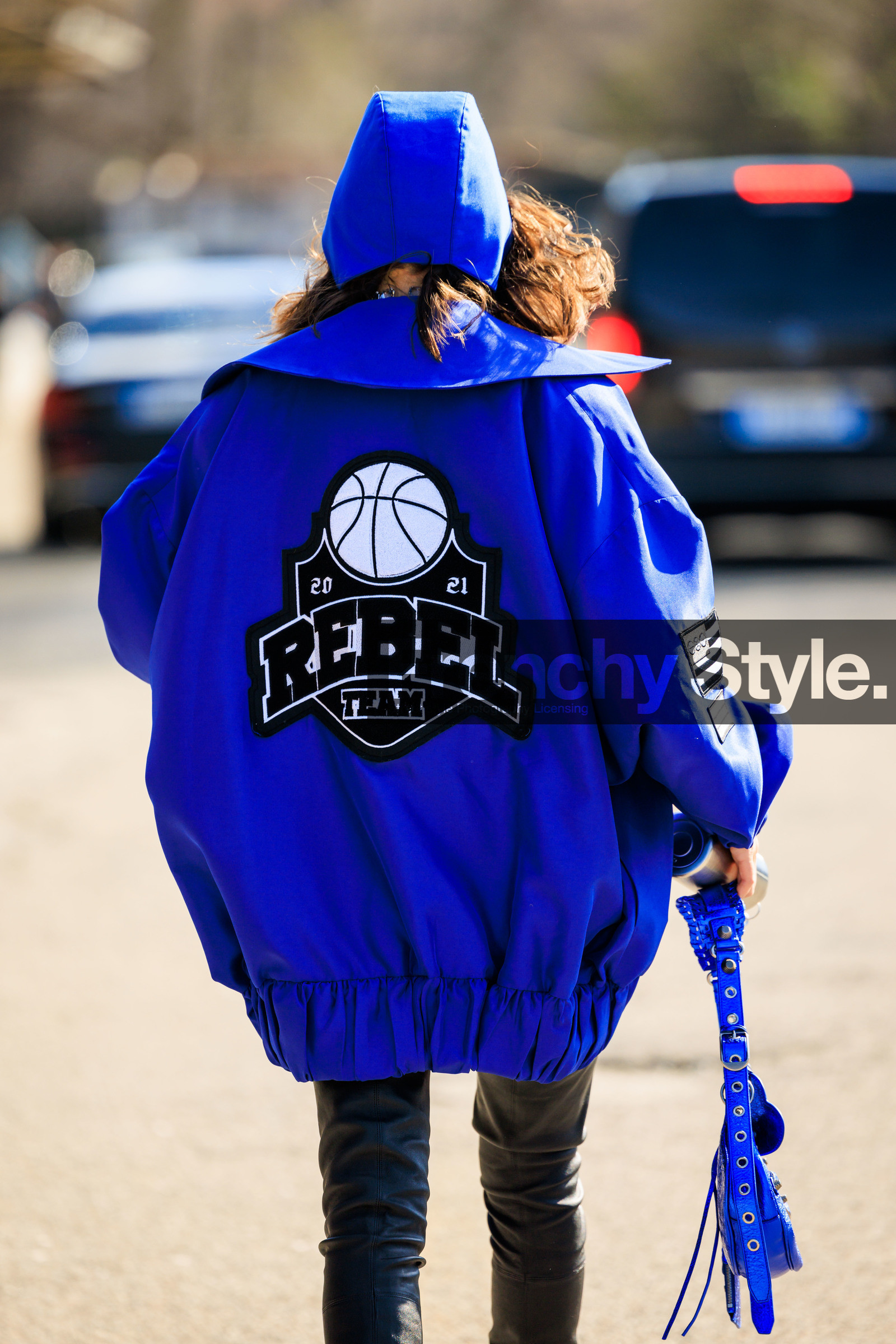 blue hood, silver, blue jacket, logo jacket, back details, black shorts, leather shorts, white boxers, blue handbag, basketball jacket, karina nigay, fashion week, frenchystyle, FW, jonathan paciullo, street style, vertical, atmosphere details, detail