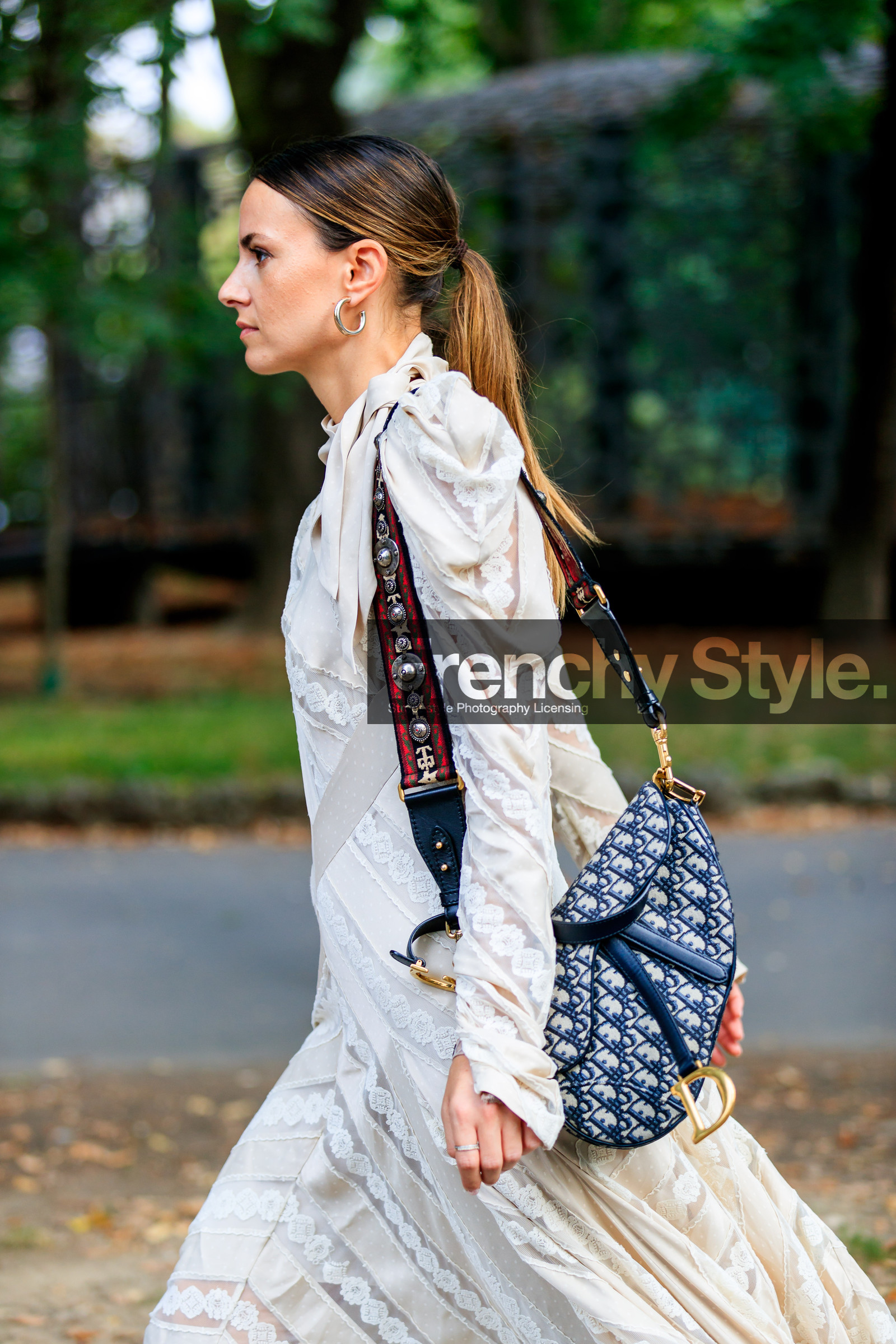 black and white bag, christian dior, graphic bag, graphic dress, lace, leather bag, monogram, ponytail, printed bag, printed dress, saddle bag, white dress, zina charkoplia, street style, jonathan paciullo, FW, frenchystyle, fashion week, MFW, MILAN, SPRING SUMMER 2019, SS 19, vertical, atmosphere details, detail