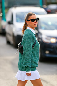 sophia roe, green pullover, white polo shirt, white skirt, celine sunglasses, black sunglasses, butterfly sunglasses, mini skirt, pleated skirt, crossbody bag, black leather bag, belt bag, backpack, lacoste pullover, lacoste skirt, lacoste polo shirt, lacoste bag, lacoste total look, fashion week, frenchystyle, FW, jonathan paciullo, street style, PFW, PARIS, vertical, atmosphere details, detail