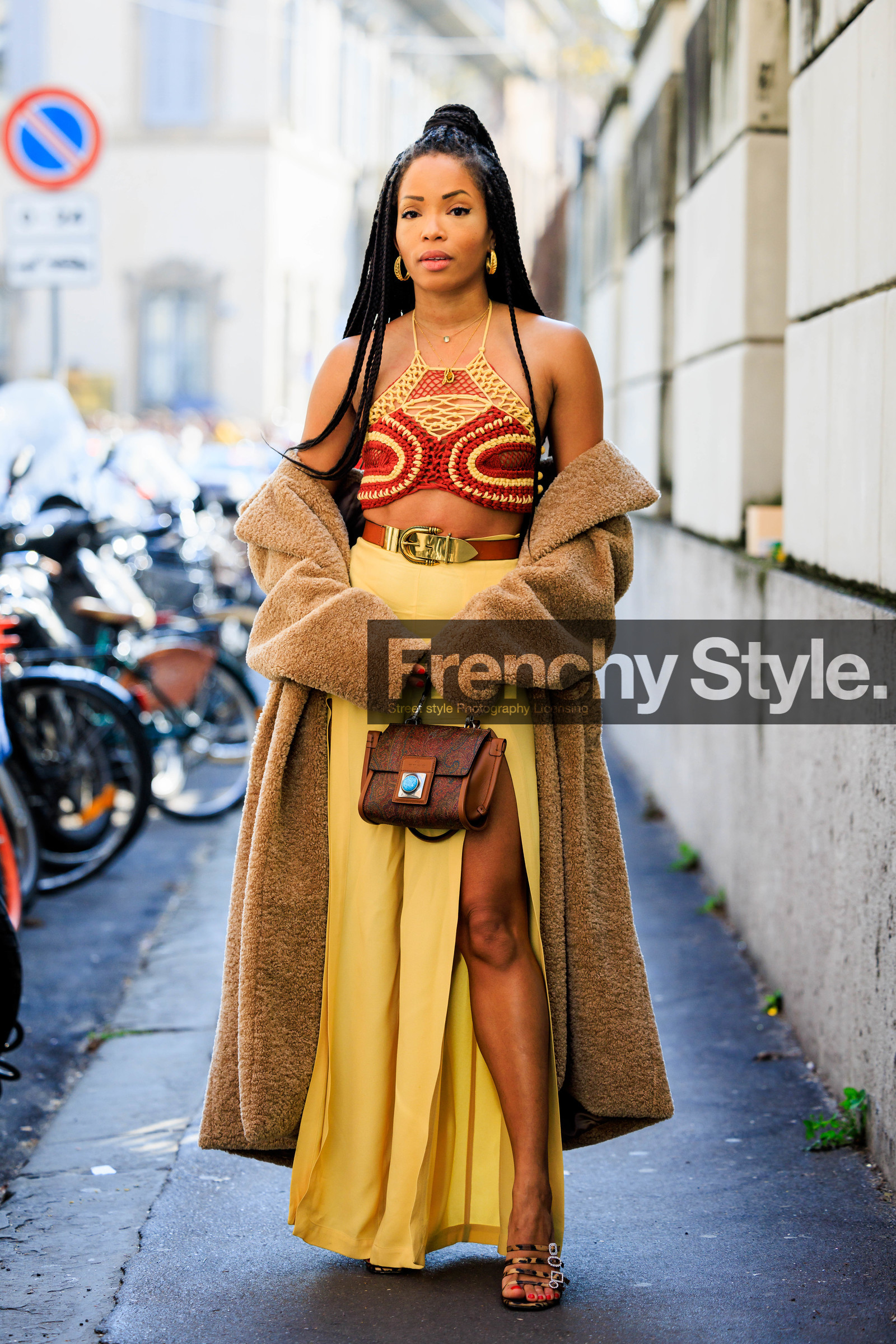 belt sandals; almond coat; furry coat; long trousers; knitted top; etro; braid; dual toned top; knitwear; golden loops; buckle belt; brown belt; yellow pants; flared pants