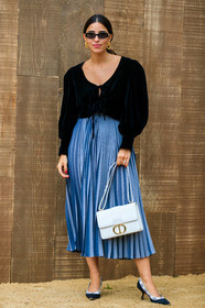 bettina looney, dior bag, dior skirt, dior shoes, 30 montaigne bag, black blouse, velvet blouse, knot details, low necked blouse, long skirt, light blue skirt, pleated skirt, white leather bag, golden buckle bag, golden earrings, golden necklace, long necklace, dangling earrings, black shoes, kitten heels shoes, sharp end shoes, logo strap shoes, fashion week, frenchystyle, FW, jonathan paciullo, street style, SPRING SUMMER 2020, SS 20, PFW, PARIS, vertical, full length