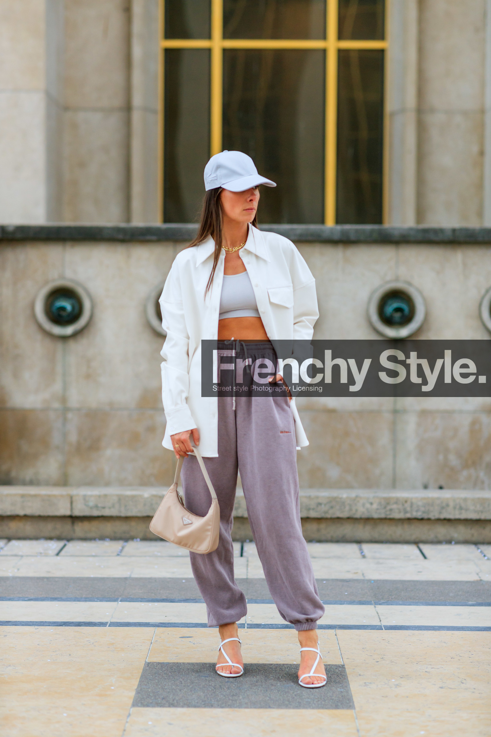 alice & j.s, alice barbier, white cap, white leather jacket, white leather shirt, white leather bag, lacoste cap, sportswear, jogging pants, purple pants, prada bag, light beige bag, white top, cropped top, kitten heels sandals, multi straps sandals, multi necklace, golden necklace, fashion week, frenchystyle, FW, jonathan paciullo, street style, SPRING SUMMER 2020, SS 20, PFW, PARIS, vertical, full length