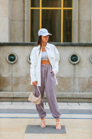 alice & j.s, alice barbier, white cap, white leather jacket, white leather shirt, white leather bag, lacoste cap, sportswear, jogging pants, purple pants, prada bag, light beige bag, white top, cropped top, kitten heels sandals, multi straps sandals, multi necklace, golden necklace, fashion week, frenchystyle, FW, jonathan paciullo, street style, SPRING SUMMER 2020, SS 20, PFW, PARIS, vertical, full length