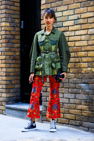 black sneakers, camera, chinese print, converse, floral, graphic pants, green jacket, leather shoes, military jacket, printed pants, red pants, trousers, street style, jonathan paciullo, FW, frenchystyle, fashion week, LFW, LONDON, AUTUMN WINTER 2018-2019, AW 18-19, FALL WINTER 2018-2019, FW 18-19, vertical, full length