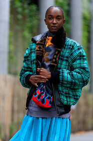 model, light blue skirt, mid long skirt, pleated skirt, prada bag, hand bag, fire printed bag, black bag, bucket bag, red bag, printed bag, dark grey t-shirt, floral printed t-shirt, silk blouse, high collar blouse, dark grey blouse, floral printed blouse, green coat, green bombers, fur collar coat, checked coat, fur coat, make up, make up details, studs make up, strassed make up, fashion week, frenchystyle, FW, jonathan paciullo, street style, SPRING SUMMER 2020, SS 20, PFW, PARIS, vertical, atmosphere details, detail