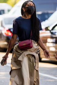 beige skirt, black t-shirt, crossbody bag, facial mask, gold earrings, leather bag, loewe bag, red bag, trenchcoat, fashion week, frenchystyle, FW, jonathan paciullo, street style, SPRING SUMMER 2022, SS 22, MFW, MILAN, vertical, atmosphere details