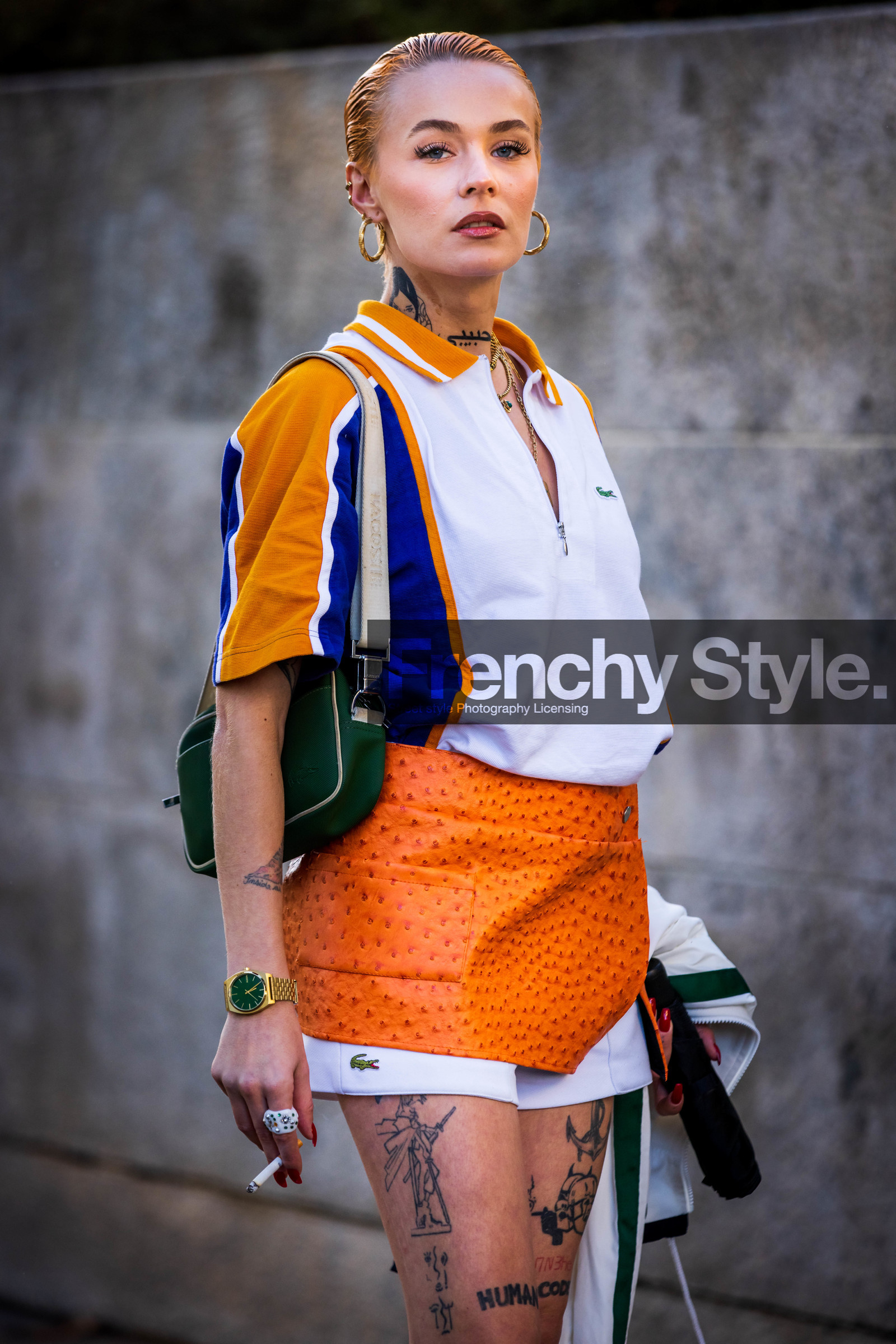 blue polo, gold watch, green bag, lacoste look, mini skirt, mocassins, Moesta Errabunda, orange skirt, polo, tattoo, watch, white polo, white shorts, zipped polo, lacoste, fashion week, frenchystyle, FW, jonathan paciullo, street style, PFW, PARIS, SPRING SUMMER 2022, SS 22, vertical, atmosphere details