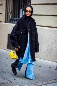 bag, black coat, black sunglasses, blue pants, coat, flare pants, hijab, large pants, Leena Al Ghouti, loewe bag, oversize coat, pants, sunglasses, yellow bag, street style, jonathan paciullo, FW, frenchystyle, fashion week, PFW, PARIS, SPRING SUMMER 2022, SS 22, vertical, full length