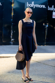 flora macdonald johnston, shu shu tong dress, black dress, sleeveless dress, asymmetrical dress, cartier watch, panthere cartier watch, silver and golden watch, hand bag, plaited bag, beige and brown bag, brown scale sunglasses, hoop earrings, golden earrings, chain necklace, multi necklace, golden bracelet, black leather sandals, open toe shoes, fashion week, frenchystyle, FW, jonathan paciullo, street style, vertical, full length