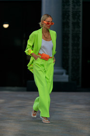 leonie hanne, suits, neon suits, gucci sunglasses, orange sunglasses, white top, big chain necklace, chain necklace, golden necklace, jacquemus bag, mini bag, orange leather bag, belt bag, bottega veneta shoes, white leather sandals, oversize jacket, oversize pants, oversize suits, neon yellow jacket, neon yellow pants, hair details, squared toed shoes, square shape bag, fashion week, frenchystyle, FW, jonathan paciullo, street style, vertical, full length