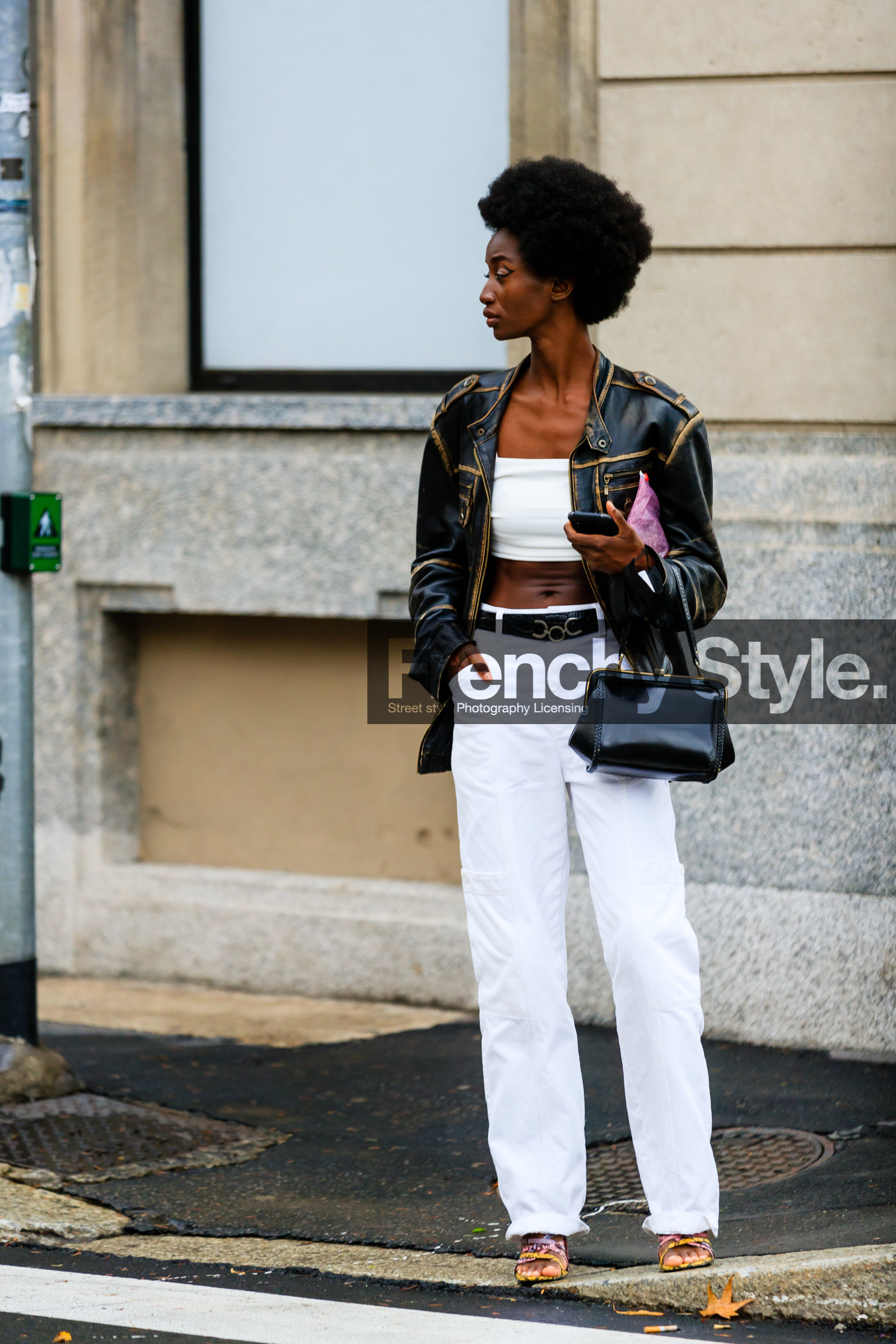 black leather jacket, black leather bag, black leather belt, used jacket, zipped jacket, white pants, flare pants, hand bag, vintage bag, belted pants, white top, cropped top, animal skin belt, sasha payton, street style, jonathan paciullo, FW, frenchystyle, fashion week, MFW, MILAN, SPRING SUMMER 2021, SS 21, vertical, full length, model
