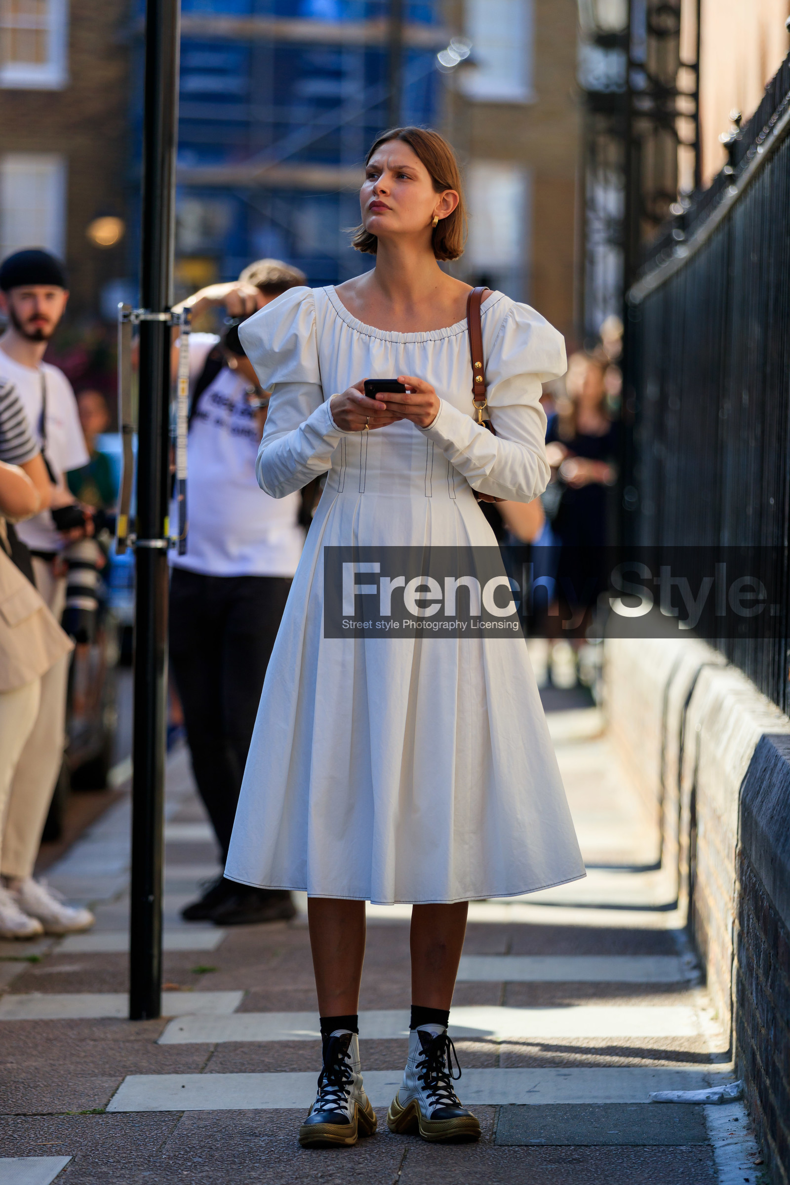 victoria sekrier, white dress, mid long dress, balloon sleeves, brown scale sunglasses, celine sunglasses, hoop earrings, golden earrings, long sleeves dress, brown leather bag, louis vuitton boots, louis vuitton sneakers, high sneakers, laced shoes, white leather shoes, white leather sneakers, golden sole, fashion week, frenchystyle, FW, jonathan paciullo, street style, vertical, full length