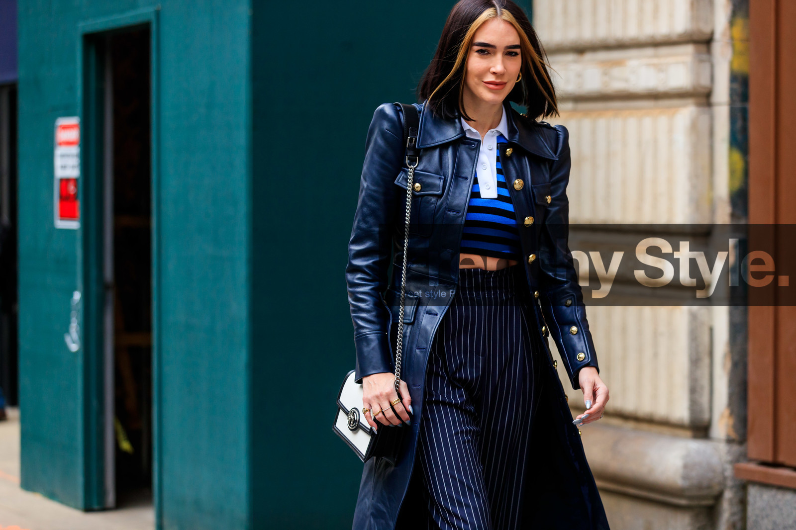 brittany xavier, michael kors jacket, michael kors jacket, michael kors look, navy blue leather jacket, navy blue pants, navy blue pullover, long jacket, striped pants, striped pullover, blue pullover, cropped pullover, high waist pants, carrot pants, polo collar pullover, golden button, multi button jacket, shoulder bag, silvered chain strap bag, black leather bag, white bag, loose pants, fashion week, frenchystyle, FW, jonathan paciullo, street style, NYFW, NEW YORK, AUTUMN WINTER 2020-2021, FALL WINTER 2020-2021, FW 20-21, horizontal, atmosphere details, detail